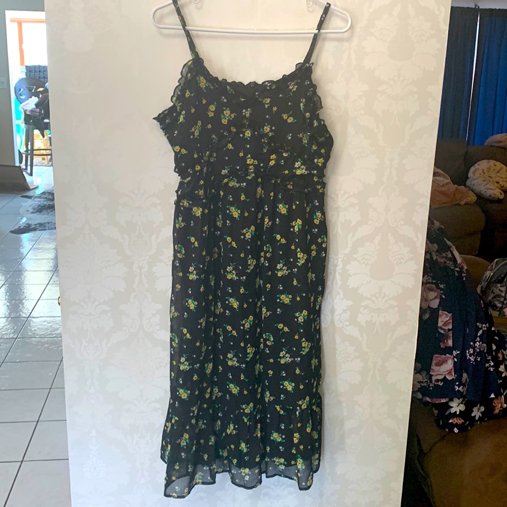Spring spaghetti strap yellow floral and black dress. Is a midi dress. Like New